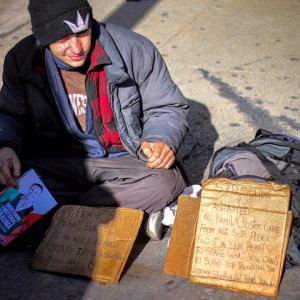 Young man homeless in Chicago. Former Foster Youth with book Overcoming Emotional Trauma.